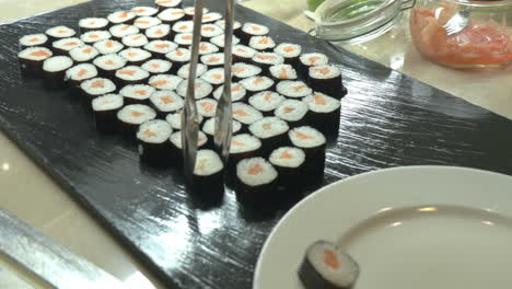 sushi rolls served on plate in japanese restaurant