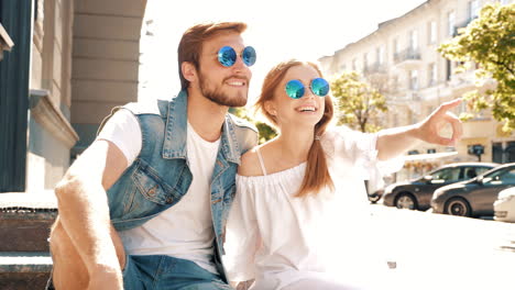 couple posing on city stairs