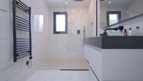 Luxurious-bathroom-having-rich-white-floors-and-walls,ascending-jib-shot