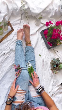 woman relaxing with flowers and plants