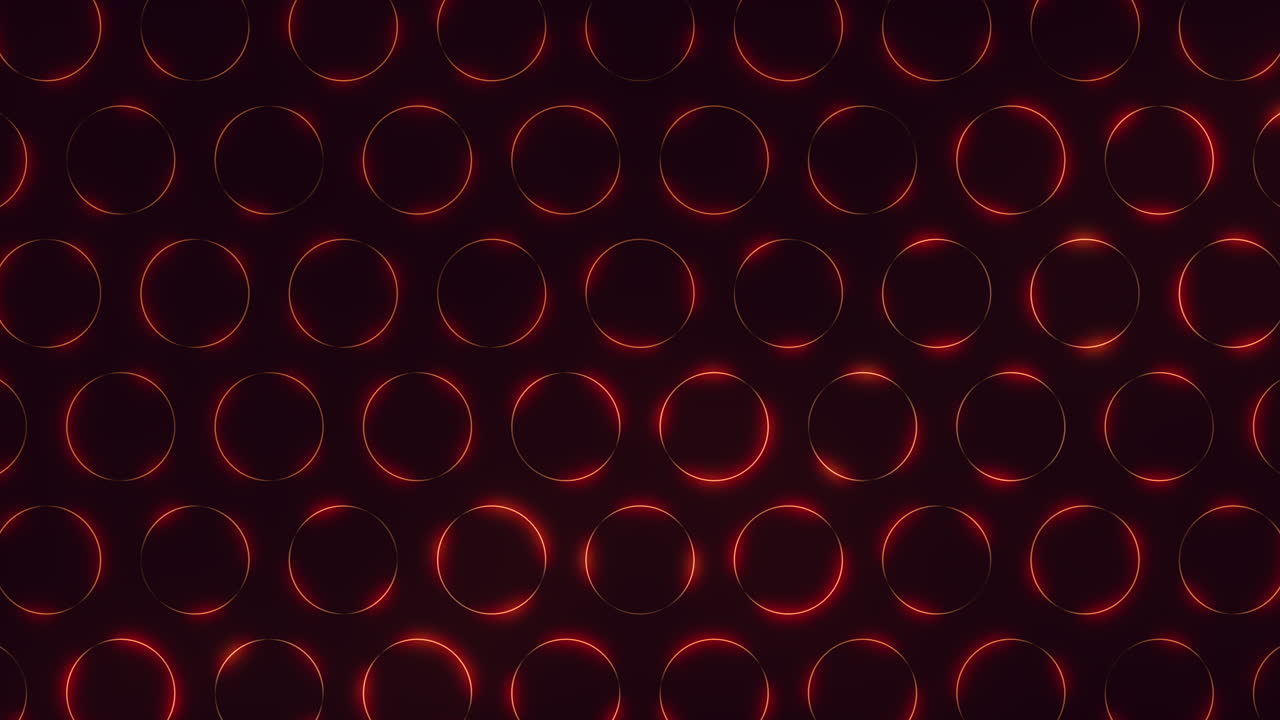 A mesmerizing arrangement of red circles in a circular pattern, seemingly floating against a black background, creates a captivating visual display