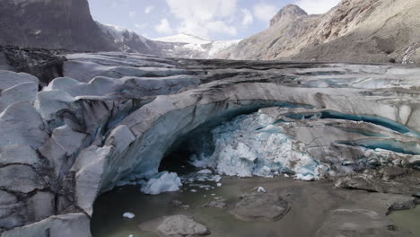 Pasterze-glacier-melting-ice-cave-due-to-climate-change,-Retreating-glacier-of-Eastern-Alps,-Austria,-Aerial-Closeup