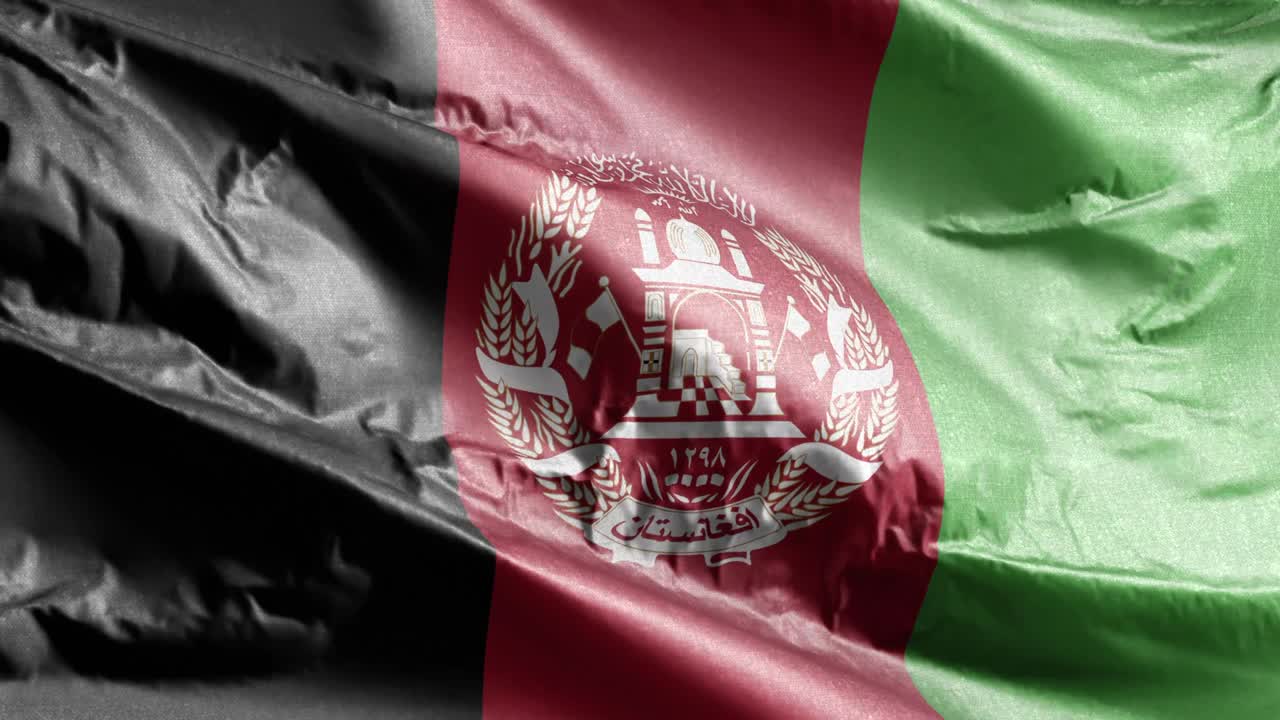 афганский текстильный флаг, размахивающий в ветре. афганский баннер, качающийся на ветре. ткань текстильной ткани. полный заполняющий фон. 10 секунд.
