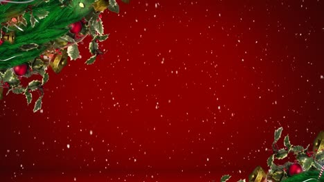 Snow-falling-over-christmas-wreath-decorations-against-copy-space-on-red-background