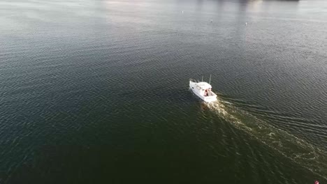 Aerial-shot-of-boat-moving-in-water