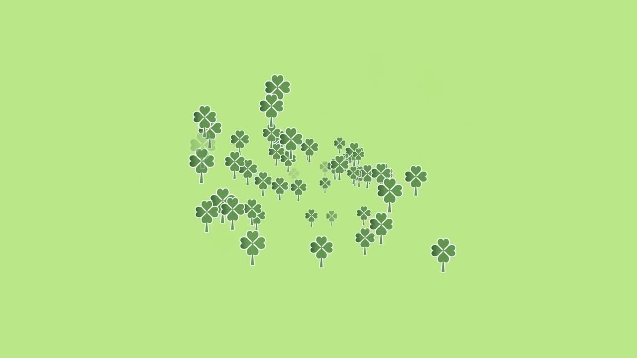 초록색 배경 위에 여러 개의 움직이는 클로버의 애니메이션