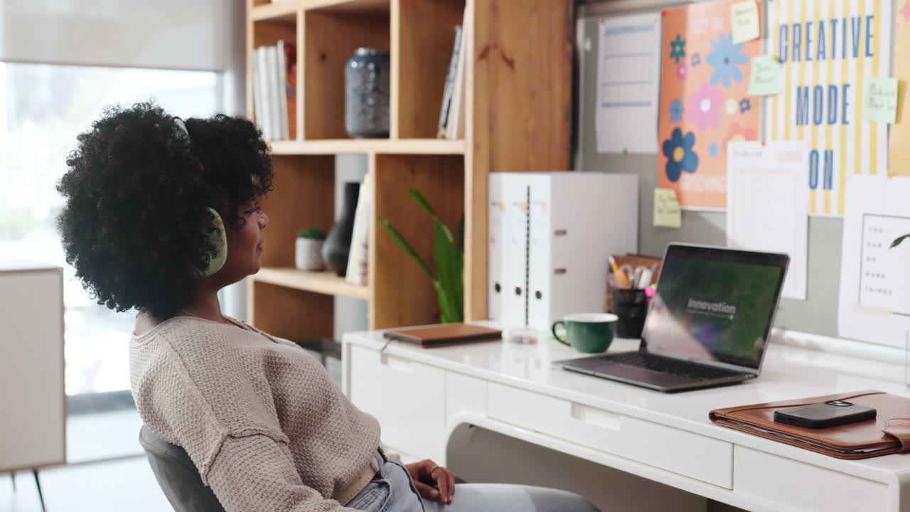 Woman Relaxing with Headphones in Home Office