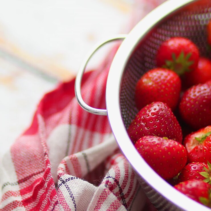 Delicious healthy fresh strawberries placed in metal strainer  Organic natural food concept 