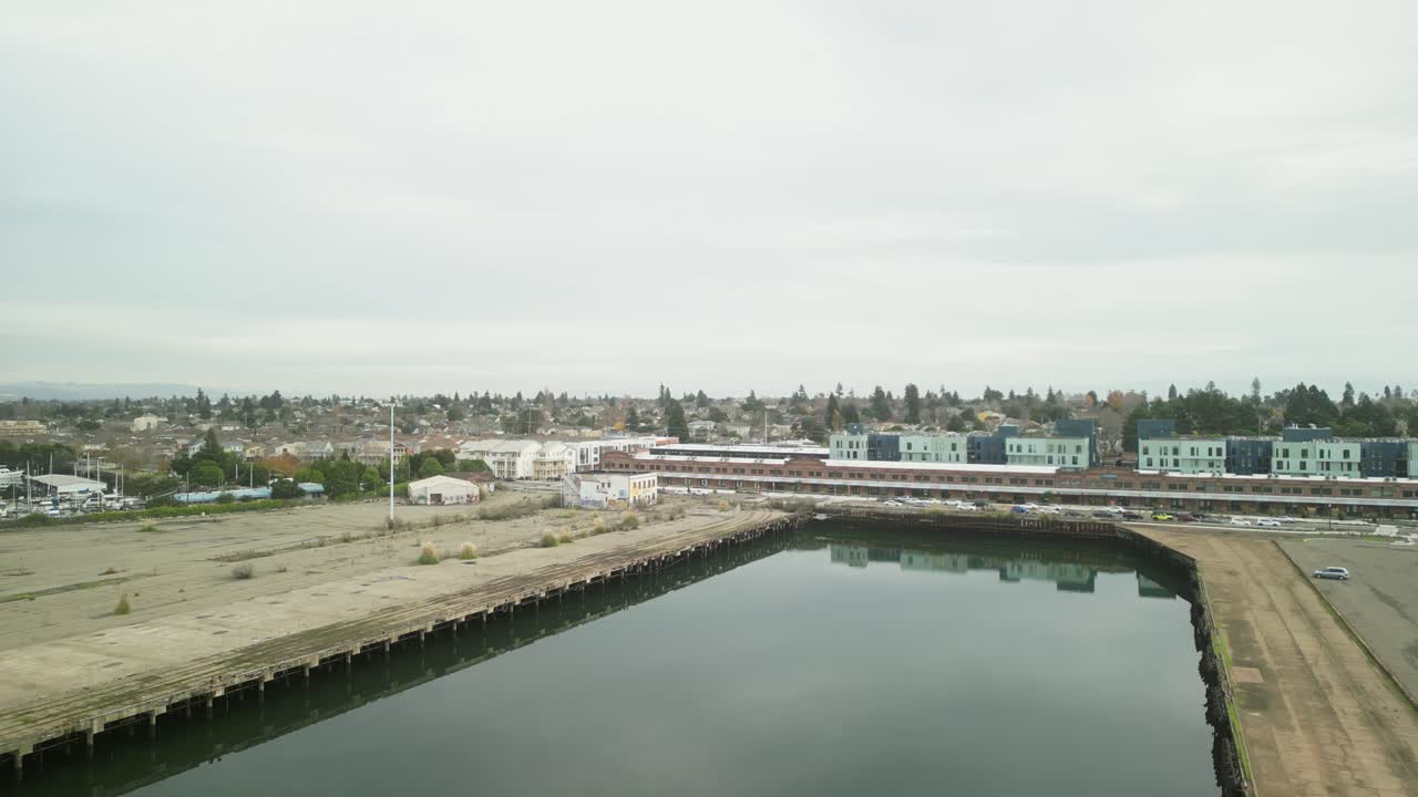 An ascending drone shot of Mariner Square in Alameda California.