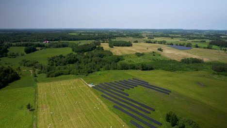 drone footage of countryside with solar panel field