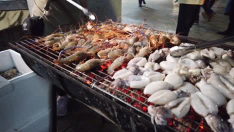 asian street vendor selling grilled seafood