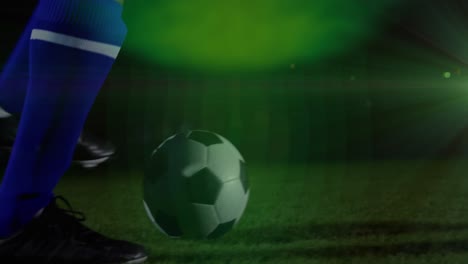 animación de punto verde de luz contra la sección media de un jugador de fútbol masculino practicando fútbol