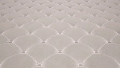 3d animation of the flight over a white quilted velvet surface. looped video.