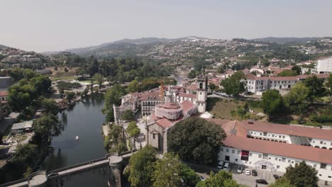establishing shot featuring sao goncalo monastery, tamega river and mountainous landscape