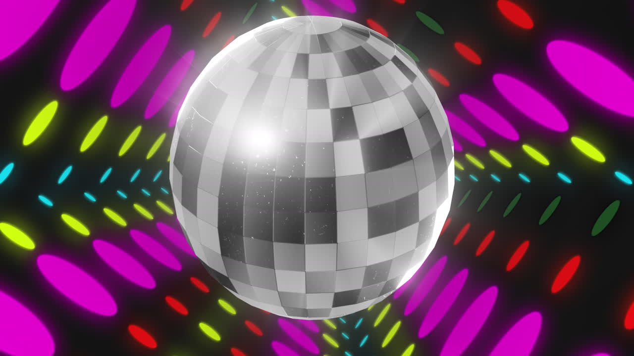 animación de una pelota de discoteca sobre manchas coloridas sobre un fondo negro