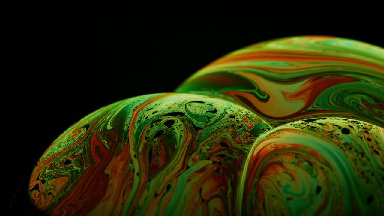 Different Color Streaks on Surface of Soap's Film Surface: Abstract Macro Shot