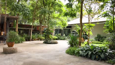 people enjoying a cafe in a lush garden setting