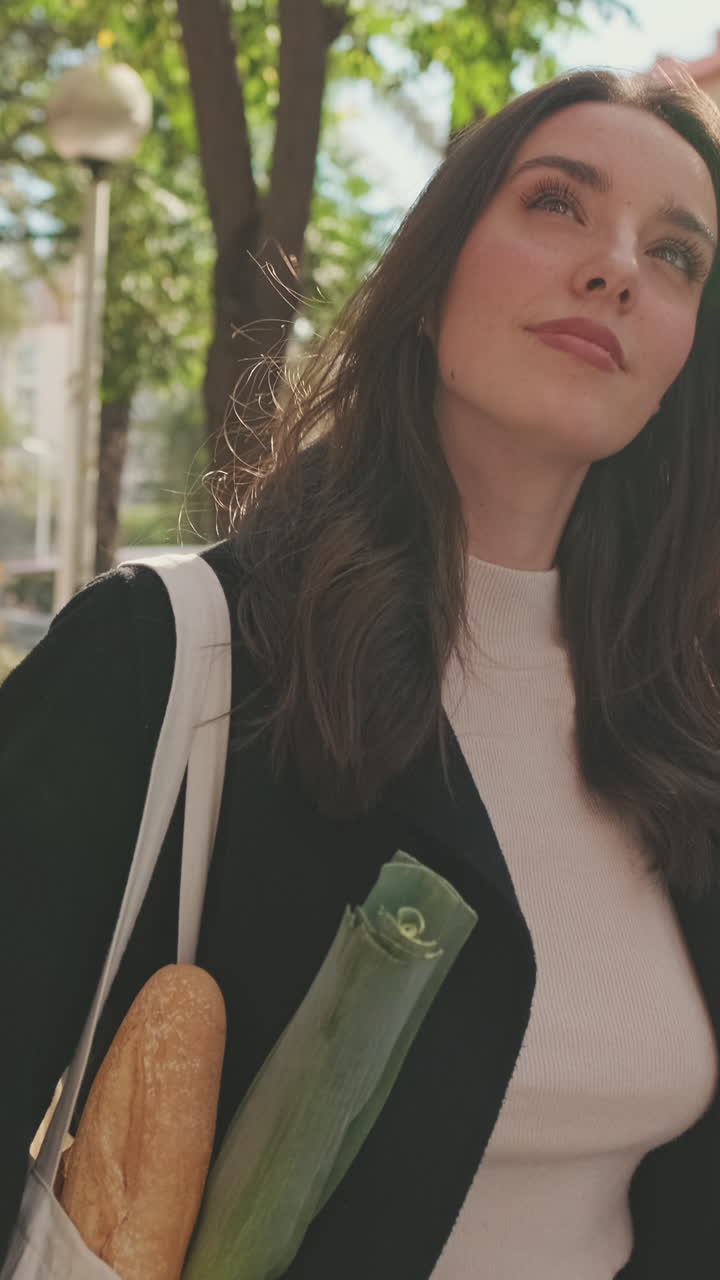 Woman with groceries outdoors