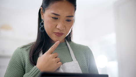 kitchen, thinking and woman with tablet