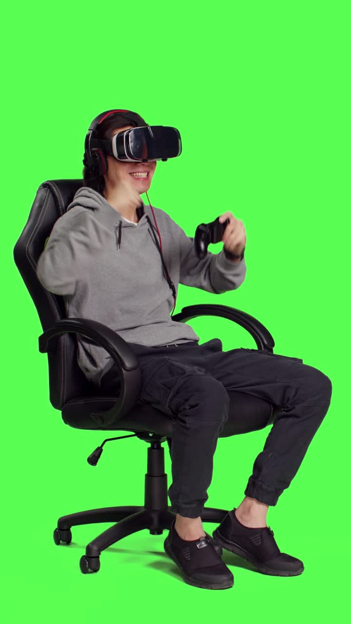 Side view of guy playing phone games with gadgets