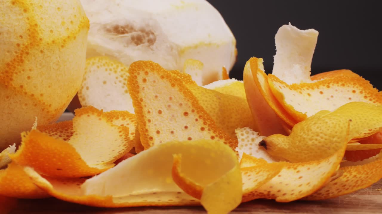 bartender makes a cocktail in a glass with orange peel. High quality 4k footage