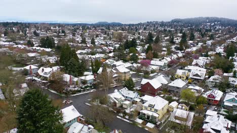 aerial over snowy winter neighborhood houses suburbs in snow in portland oregon 1