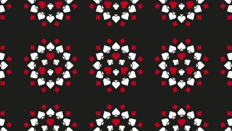 símbolos de cartas de juego (diamantes, palos, corazones y picas) en un fondo negro. concepto de juego gráfico de movimiento simple patrón animado