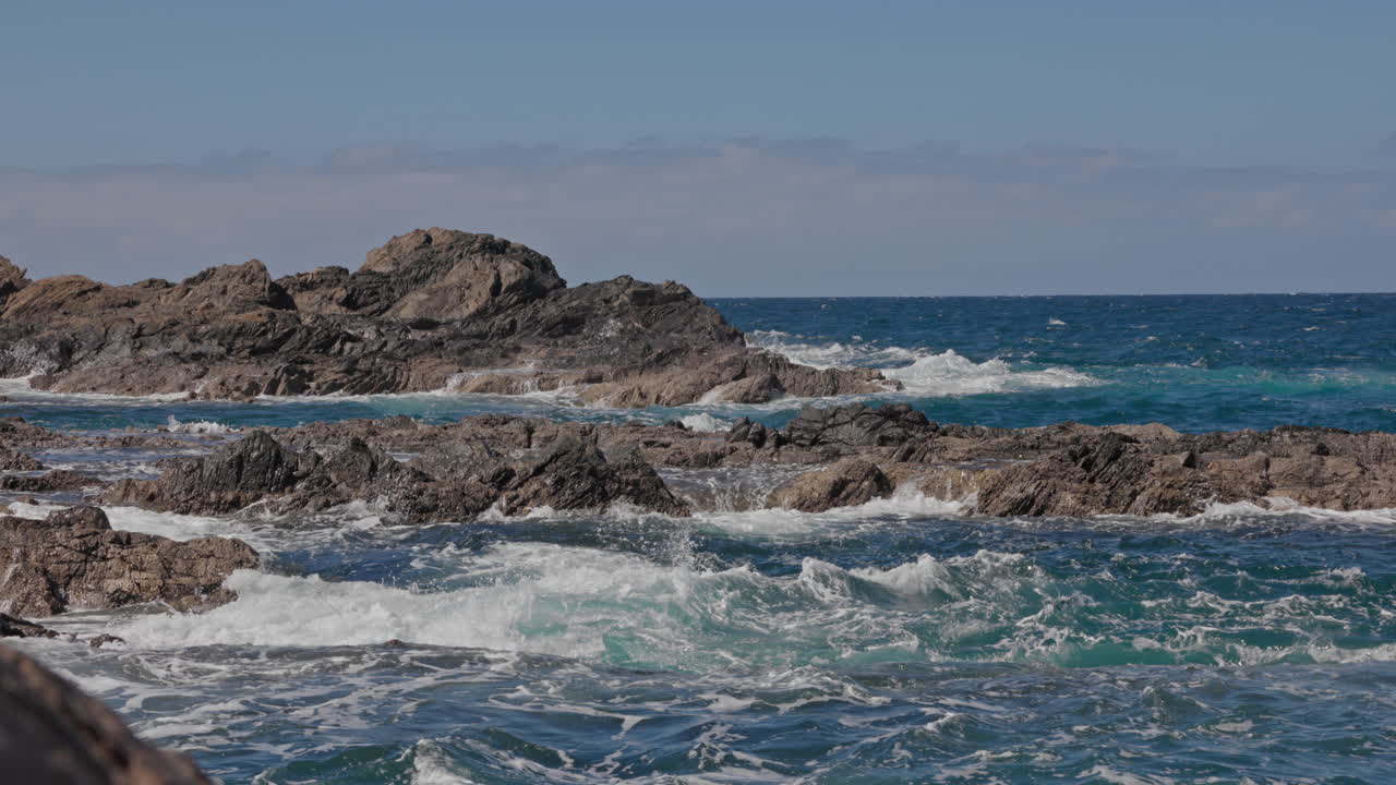 Breathtaking views of Fuerteventura with Lobos Island, Red Flag Beach, kite surfers, sunsets, volcanoes, sand dunes, and wingfoilers in the Canary Islands’ golden light.