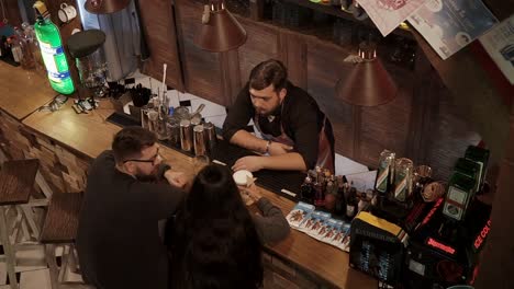 couple enjoying drinks at a cozy bar