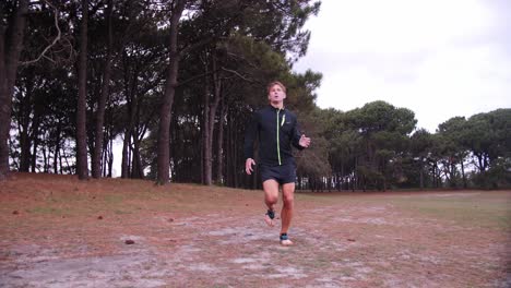 man jogs past with trees in background