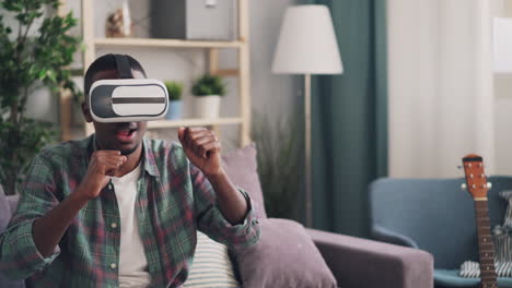 man using vr headset at home