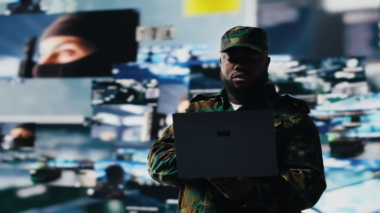 Officer monitoring real time combat data using advanced military systems