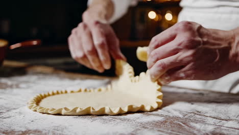 chef preparing pasta or pastry in a restaurant kitchen