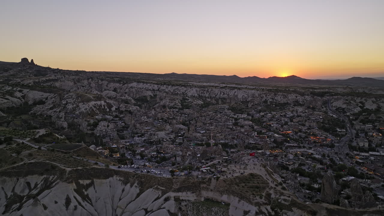 Göreme Turkey Aerial v35 panoramic view drone flyover high plateau sunset view point capturing natural landscape of unique rock formations and ancient village town - Shot with Mavic 3 Cine - July 2022