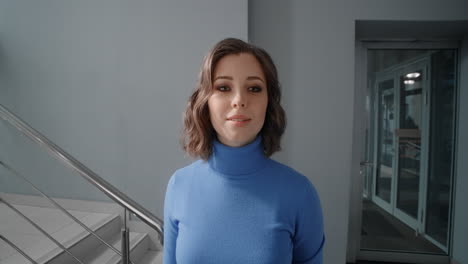 woman taking selfie in office building