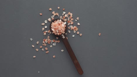 pink salt in wooden spoon