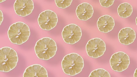 patrón de frutas coloridas de limones frescos en fondo rosa con sombras. patrón sin costuras con rebanadas de limón. animación realista. movimiento de video 4k