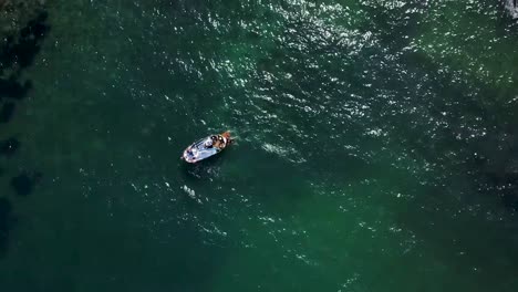 fling up and above a yacht on a green mediterranean sea