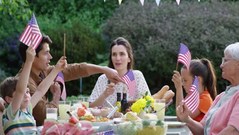 family eating outside together in summer