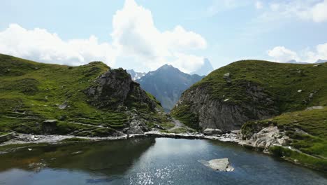 drone dolly shot of a mountain lake in the beautiful swiss alps