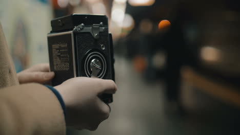 woman making shot of arriving underground train