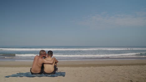 father and son enjoying a sunny beach day