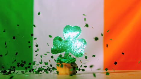 Shamrock-confetti-falling-on-st-patricks-day-cupcake