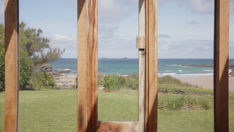 static cu view from a glazed timber timber home in a spectaular seaside location