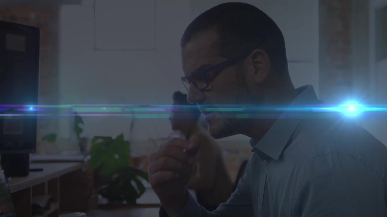 Summarize:the video features a man working at a desk in an office