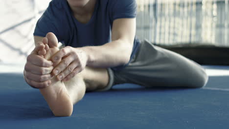man stretching his legs