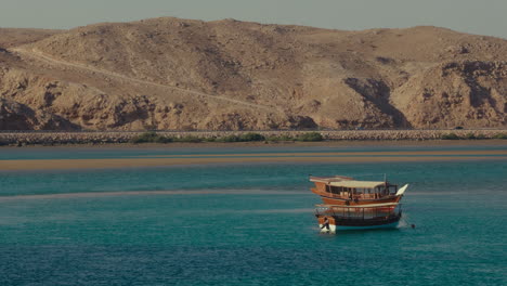 dhow boat in a coastal bay