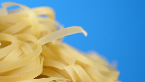 tagliatelle dry pasta rotates slowly.