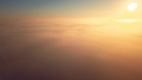 sun rising above the clouds