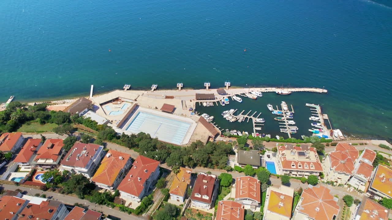 Aerial drone view of Kinaliada, Turkey. Sea port and residential buildings located on the shore of Marmara sea